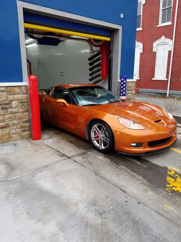 Orange Corvette at the entrance to Star City Car Wash